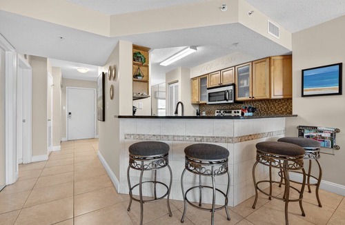 Seawinds Condo Condo | Direct oceanfront 2/2 condo with a private balcony, heated beachfront pool, and garage