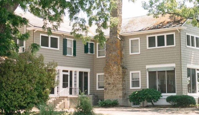 Main Residence: 5 beds, 5 baths, sleeping porches, & full kitchen.