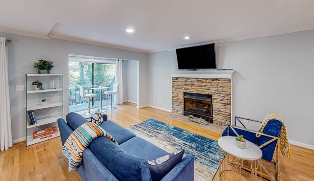 Riverfront townhome with two decks, fireplace, gazebo & woodland views